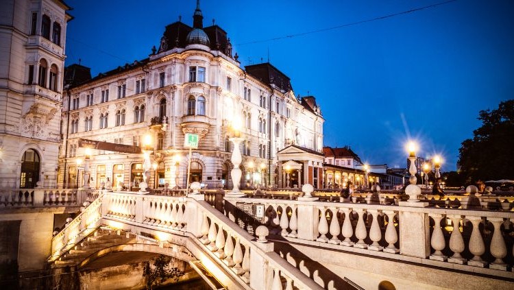 Ljubljana old town at night with river reflections
