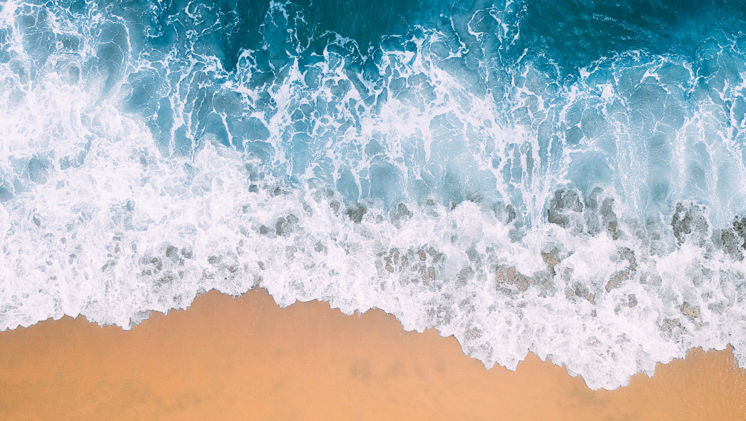 Water and sand at a solo beach vacation destination