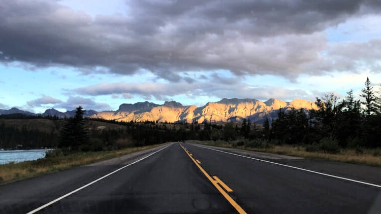sweeping mountain highway on a blue-sky day