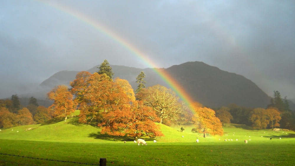 Rainbow over hills and water in England’s Lake District